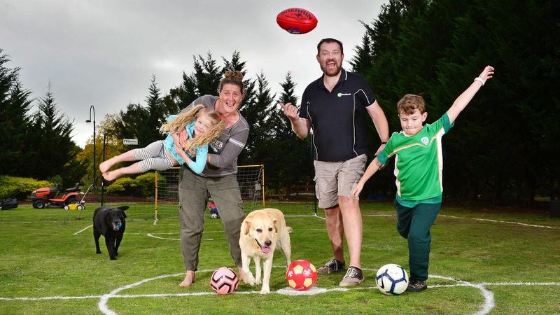 The family and their labradors Bella and Zippah enjoy the soccer field. Picture: Nicki Connolly Source: News Corp Australia